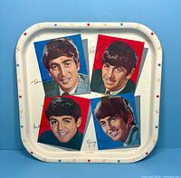 Full view of square metal tray with The Beatles portraits and border decoration