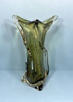 Full profile view of vintage green Sommerso art glass vase with clear outer layer, showing organic form and flared rim.
