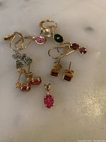 Top-down shot of all jewelry on white marble