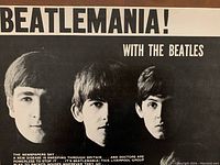 Close-up of front cover showing 'Beatlemania! With The Beatles' with portraits of three members