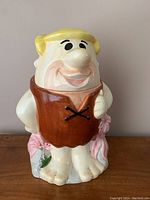 Front view of Barney Rubble cookie jar showing facial and clothing details