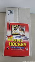 Closed 1991-92 Score NHL bilingual box with promotional graphics including Bobby Orr cards and indication of 36 player card packs.