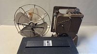 Westinghouse electric fan, Specto film projector and Panasonic tape recorder grouped together in photo