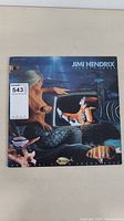 Front cover of Jimi Hendrix Johnny B. Goode LP album with underwater themed artwork and mermaid image.