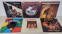 Six vinyl LP album covers showing artwork for bands Goddo, Steve Miller Band, Pagliaro, Erasure, Grand Funk and a worn album.