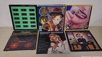 Front view of six vinyl album covers including Culture Club, Bruce Springsteen, Kenny Rogers, Heart, and others to illustrate variety and condition.