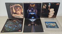 Photo showing 6 vinyl album covers including David Bowie, Cat Stevens and others.