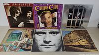 Front-facing view of 6 LP album covers showing Jim Glaser, Culture Club, McVicar, Phil Collins, Paul Mauriat, and one more album.