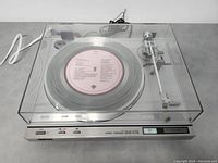 Front view with dust cover closed showing overall unit