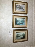 Three framed Keirstead prints hanging on wall, showing overall lot condition and framing style