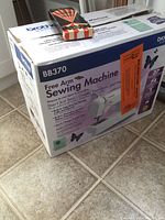 Box of Brother BB370 Free Arm Sewing Machine showing front with branding, model, features, and butterfly graphics.