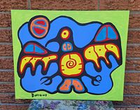 Front view of the original acrylic painting depicting the Thunderbird with bold blue, yellow, red, orange, and black colors against a green frame.