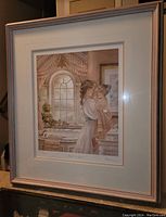 Framed fine art print shown hanging, capturing the full image and frame in the room environment.