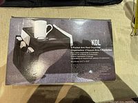 Box showing KOL brand 6 pocket armrest organizer with clear image of packaging and product dimensions.