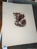 Overall view of the 8x10 signed abstract sketch on mylar showing three stylized human faces and forms in brown ink.