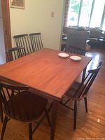 Six chairs arranged around dining table, showing overall set and seat coloration
