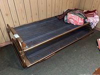 Two‐tier bunk bed frame folded down, full view