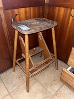 Photo of vintage wooden step stool showing rectangular top and folded steps underneath