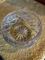 Top-down view showing central pinwheel cut design and detailed geometric patterns along the walls of the bowl.