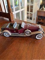 Maroon and silver Franklin convertible model car showing side and interior details