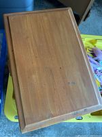 Top view of wooden box lid showing surface scratches and minor wear.