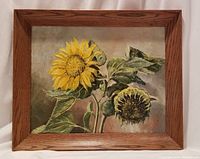 Full view of framed oil painting showing sunflowers against draped background