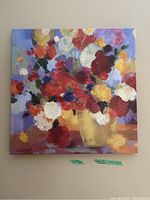 Full view of floral canvas painting showing colorful flowers in a yellow vase on a purple background.