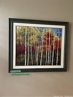 Full view of framed painting showing birch trees with autumn leaves in a green frame with gold inner accents.
