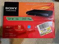 Photo of Sony DVD player box showing model number DVP-SR310P, branding, and condition (sealed box).