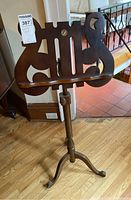 Full view of wood music stand showing lyre-style sheet holder, tripod base and overall height