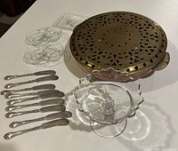 Overview of all items in the lot including warming plate, butter spreaders, double dips, and glass bowls.