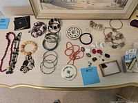 Overview of all jewelry items laid out on table