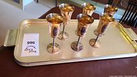 Overall view showing six goblets arranged on the silver-plated rectangular tray