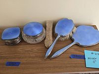 All five pieces arranged on wood surface