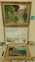 Three paintings displayed; top is a river scene with bridge and hanging greenery, middle is coastal marsh, bottom is seaside with boats.