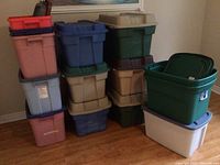 Overall view of stacked totes in various colors and sizes