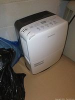 Left-side and top view showing control panel and brand name Garrison on front.