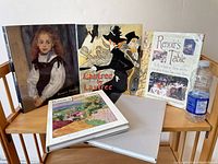 Front covers of 5 art books, including a portrait on one cover and illustrated cover for Lautrec book.