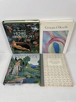 Front view of four hardcover art books arranged in a rectangular layout showing covers: Rousseau, O'Keeffe, McKnight, Cassatt.