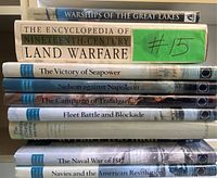 Stack of 10 naval history books arranged horizontally, showing spines with titles on naval wars and battles.