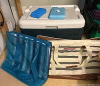 Overview of Coleman cooler, two cooler bags, and two ice packs on cooler lid.