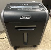 Front view of Fellows Powershred 79Ci showing the brand label, paper slot, and control panel.