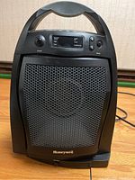 Front view of larger Honeywell electric heater showing grille and handle