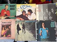 Photo of first 6 LP records including Buddy Knox, Simon & Garfunkel, The Mamas and the Papas, Ian & Sylvia, Mud Slide Slim