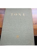 Cover of the vintage art book 'TONE' in green cloth with gold text.