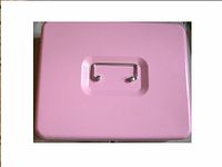 Closed pink metal cash box showing silver handle on top
