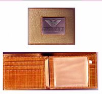 Top and interior views of Giorgio Armani wallet showing canvas front with metal logo and multiple card compartments with ID window.