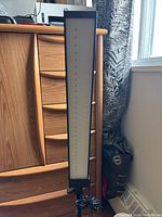 LED light panel upright showing rectangular LED array with diffuser and attached power cord.