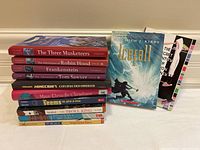 Stack of chapter books for younger readers including classics and Minecraft theme
