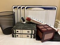 Full lot view with trash can, calendars, photo box, charts, and lockspring boxes